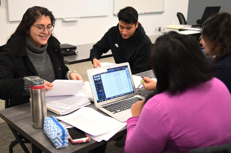 WSOB students around a computer